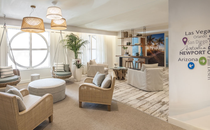 Employees and potential clients exit out of the bank building's black granite elevators onto a very different beachy environment within a few floors.