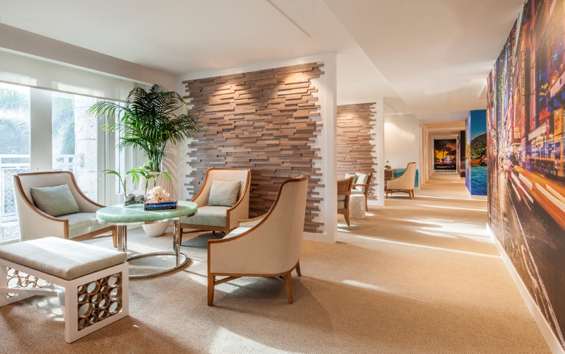 Employees and potential clients exit out of the bank building's black granite elevators onto a very different beachy environment within a few floors.